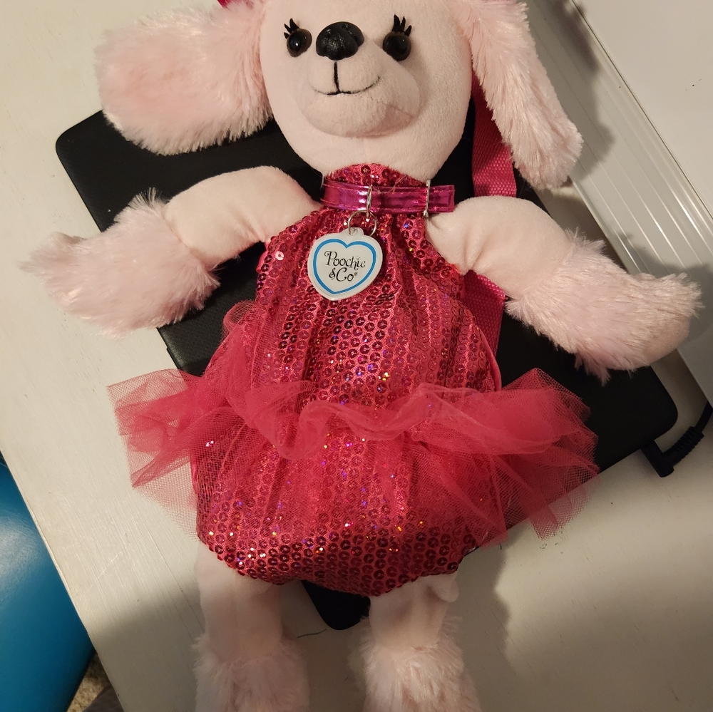 Poochie & Co. Pink poodle backpack/purse.
